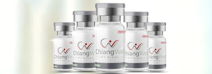 Group of glass vials labeled “ChiangWei Medical” containing white substance, arranged in front of a light background.