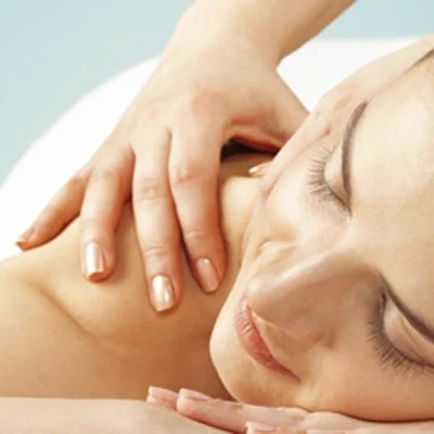 Close-up image of a person lying face down with one hand resting on the shoulder and head turned sideways.